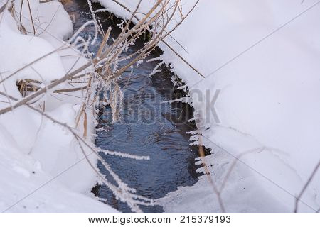 Winter Stream. Small Taiga River In The Winter.