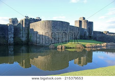 Caerphilly Castle reflected in the lake, Wales