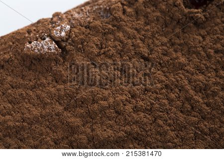 Chocolate cheesecake with cacoa powder. Photo can be used as a whole background.