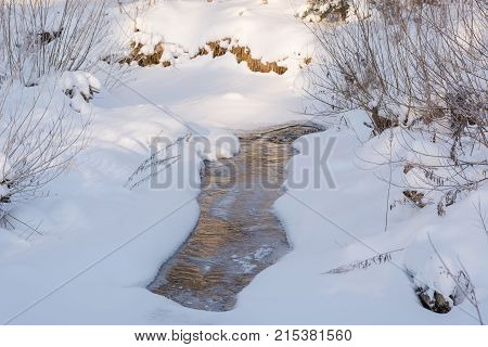 Winter Stream. Small Taiga River In The Winter.