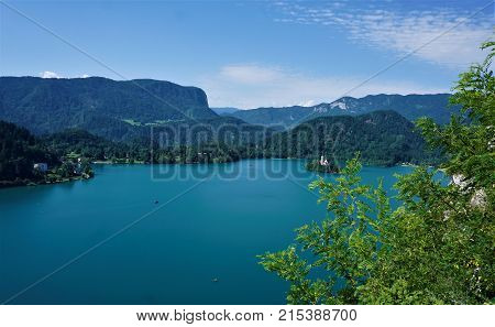 Lake and island Bled Slovenia with hills and Pletna boats