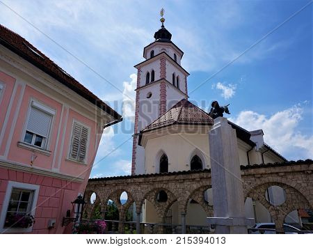 Pink house and Saint Roch's Church in Kranj Slovenia