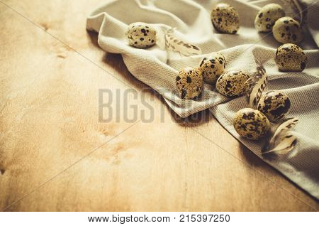 Fresh Organic Quail Eggs on Wooden Table. Retro Vintage Style Stile. Selective Focus.