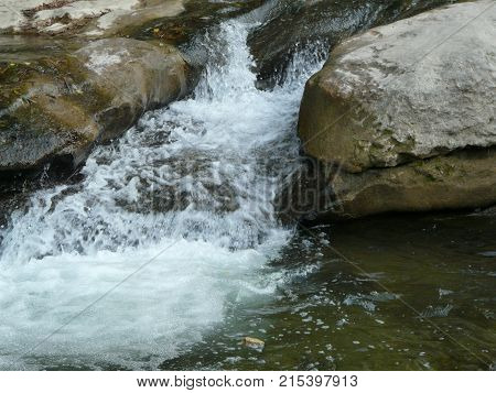 Waterfalls in the mountains of the North Caucasus surrounded by beautiful autumn nature