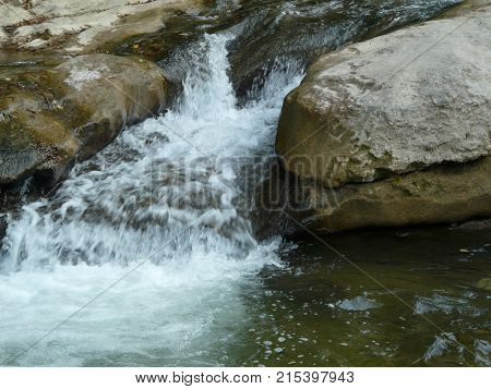 Waterfalls in the mountains of the North Caucasus surrounded by beautiful autumn nature