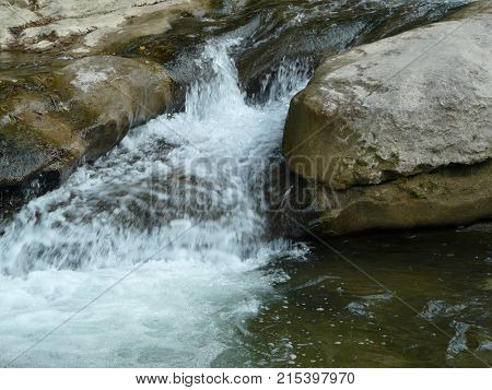 Waterfalls in the mountains of the North Caucasus surrounded by beautiful autumn nature