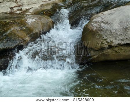 Waterfalls in the mountains of the North Caucasus surrounded by beautiful autumn nature