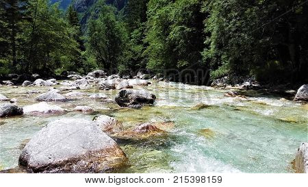 Isonzo River Slovenia - crystal clear water rocks and forest
