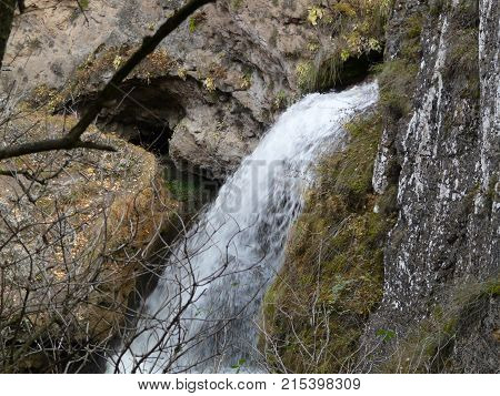 Waterfalls in the mountains of the North Caucasus surrounded by beautiful autumn nature