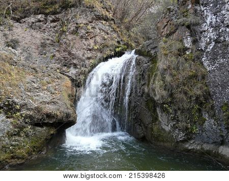 Waterfalls in the mountains of the North Caucasus surrounded by beautiful autumn nature