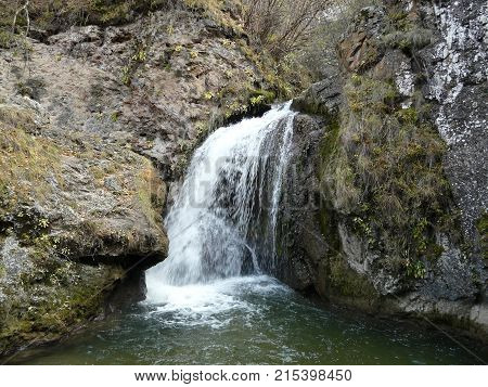 Waterfalls in the mountains of the North Caucasus surrounded by beautiful autumn nature