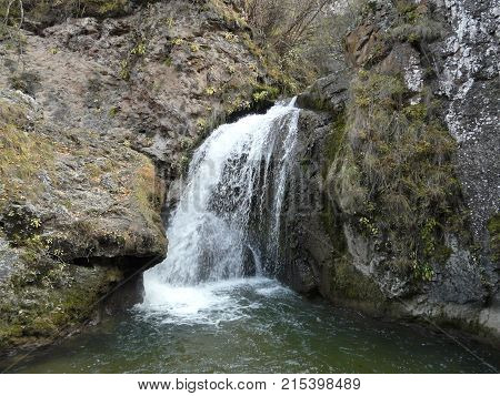 Waterfalls in the mountains of the North Caucasus surrounded by beautiful autumn nature