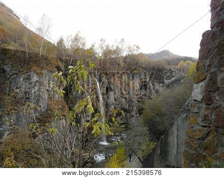 Waterfalls in the mountains of the North Caucasus surrounded by beautiful autumn nature
