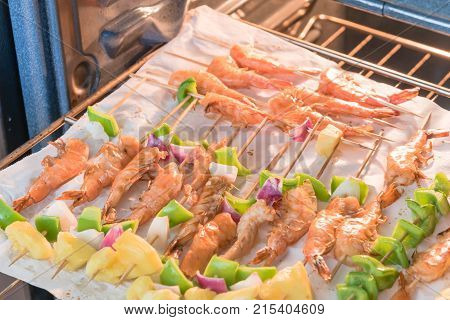 Homemade Skewer With Delicious Grilled Shrimps On Parchment Paper