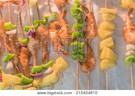 Homemade Skewer With Delicious Grilled Shrimps On Parchment Paper