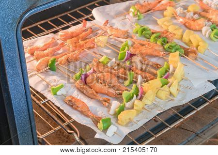 Homemade Skewer With Delicious Grilled Shrimps On Parchment Paper