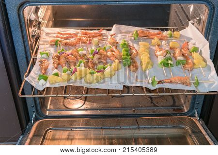 Homemade Skewer With Delicious Grilled Shrimps On Parchment Paper