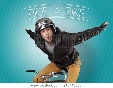 Kooky young guy on a bike with cyclist keywording and streaky background