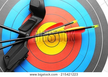 Target with bow and arrows for archery, closeup