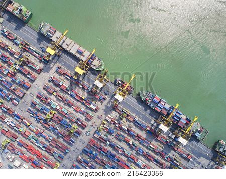 containercontainer ship in import export and business logisticBy craneTrade Port Shippingcargo to harbor. Aerial view Water transportInternationalShell Marinet ransportation logistictra deport