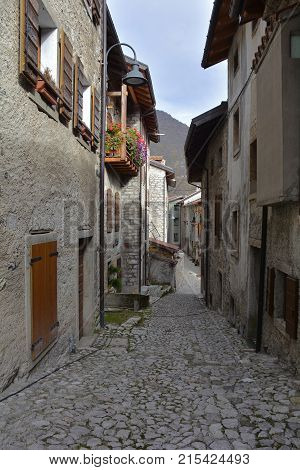 A small street in the hill village of Erto in Friuli Venezia Giulia north east Italy. The village is famous locally for having being evacuated following the 1963 Vajont Dam disaster.