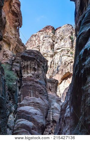 The Siq of Petra shows unique colorful rock formations in the nabatean city of Petra in Jordan