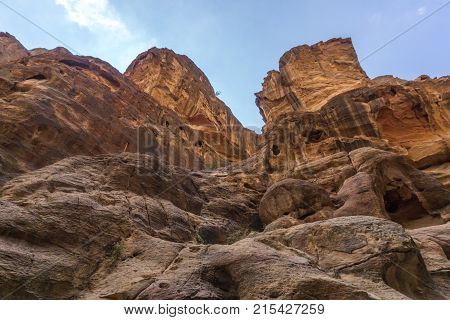 The Siq of Petra shows unique colorful rock formations in the nabatean city of Petra in Jordan