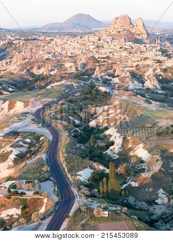 Love valley in Goreme village, Turkey. Rural Cappadocia landscape. Stone houses in Goreme, Cappadocia. Countryside lifestyle.