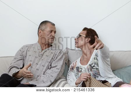 Horizontal Portrait Of Emotional Attractive Mature Female Wearing Bright Make Up And Eyeglasses Knit