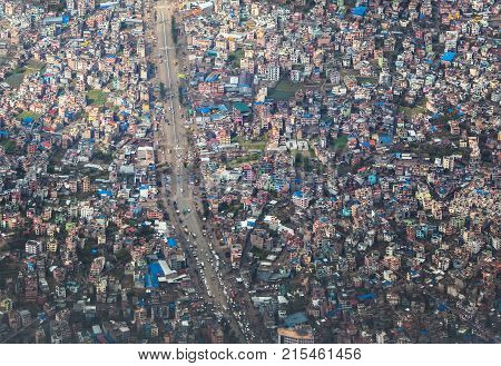 Top view on chaos of colored buildings - the heap of houses in the Asian cities caused by big overpopulation.