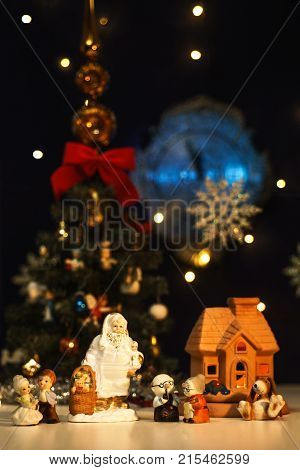 Postcard with New Year's greetings from Santa Claus and a cheerful family
