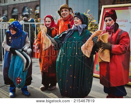 Russia. Moscow.Red square 26 Feb 2017. Carnival Maslenica . clowns entertain and sing in the street