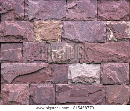 Stone wall texture, travertine tiles facing stone background