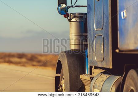 American Semi Truck on the Road. Closeup Photo. Transportation Concept.