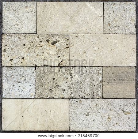 Stone wall texture, travertine tiles facing stone background