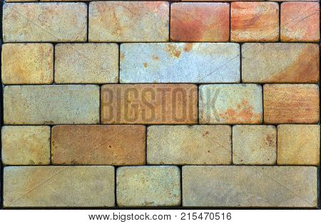 Stone wall texture, travertine tiles facing stone background