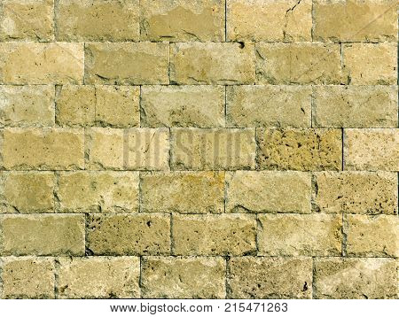 Stone wall texture, travertine tiles facing stone background