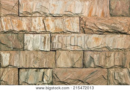 Stone wall texture, travertine tiles facing stone background