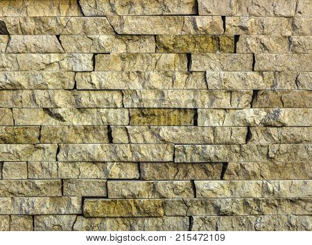 Stone wall texture, travertine tiles facing stone background