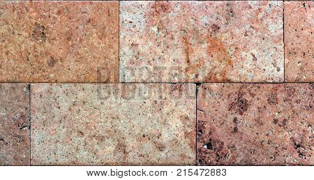 Stone wall texture, travertine tiles facing stone background