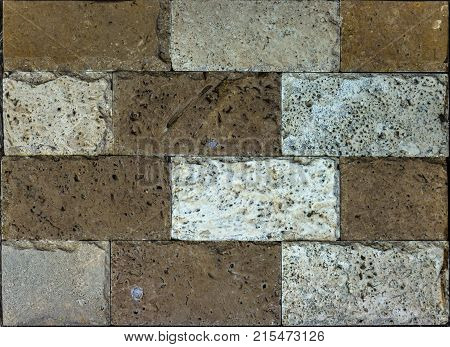 Stone wall texture, travertine tiles facing stone background