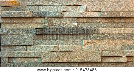 Stone wall texture, travertine tiles facing stone background