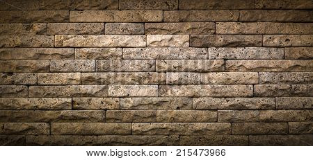 Stone wall texture, travertine tiles facing stone background