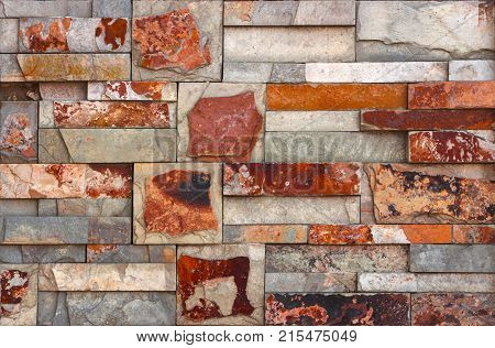 Stone wall texture, travertine tiles facing stone background
