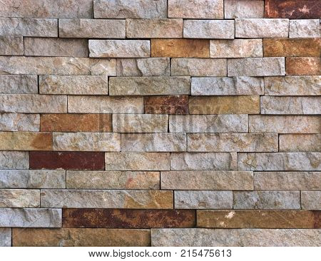 Stone wall texture, travertine tiles facing stone background