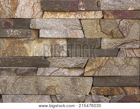 Stone wall texture, travertine tiles facing stone background