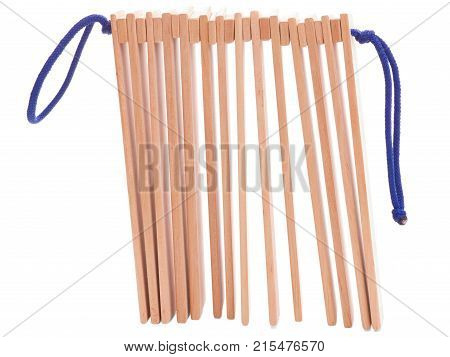 Wooden ethnic musical instruments - ratchet of the plates with two handles, isolated on a white background