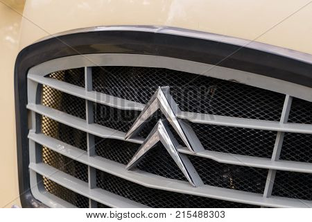 OSWESTRY, UK - SEPTEMBER 24, 2016: Radiator grill of restored cream colored Citroen 2CV6 french car