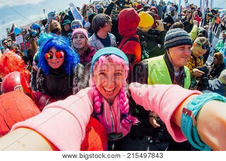 Girl With Pink Hair Shooting Selfie With People Dressed In Carnival Costumes