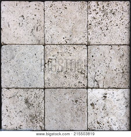 Facing tile from travertine with a smooth surface texture